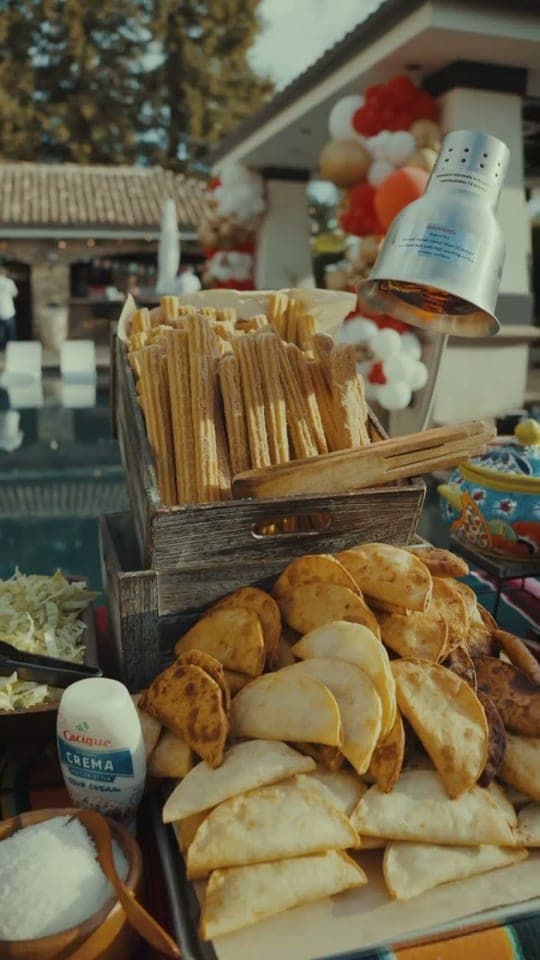 That Mexican Guy Catering event setup with branded buffet and chafing dishes